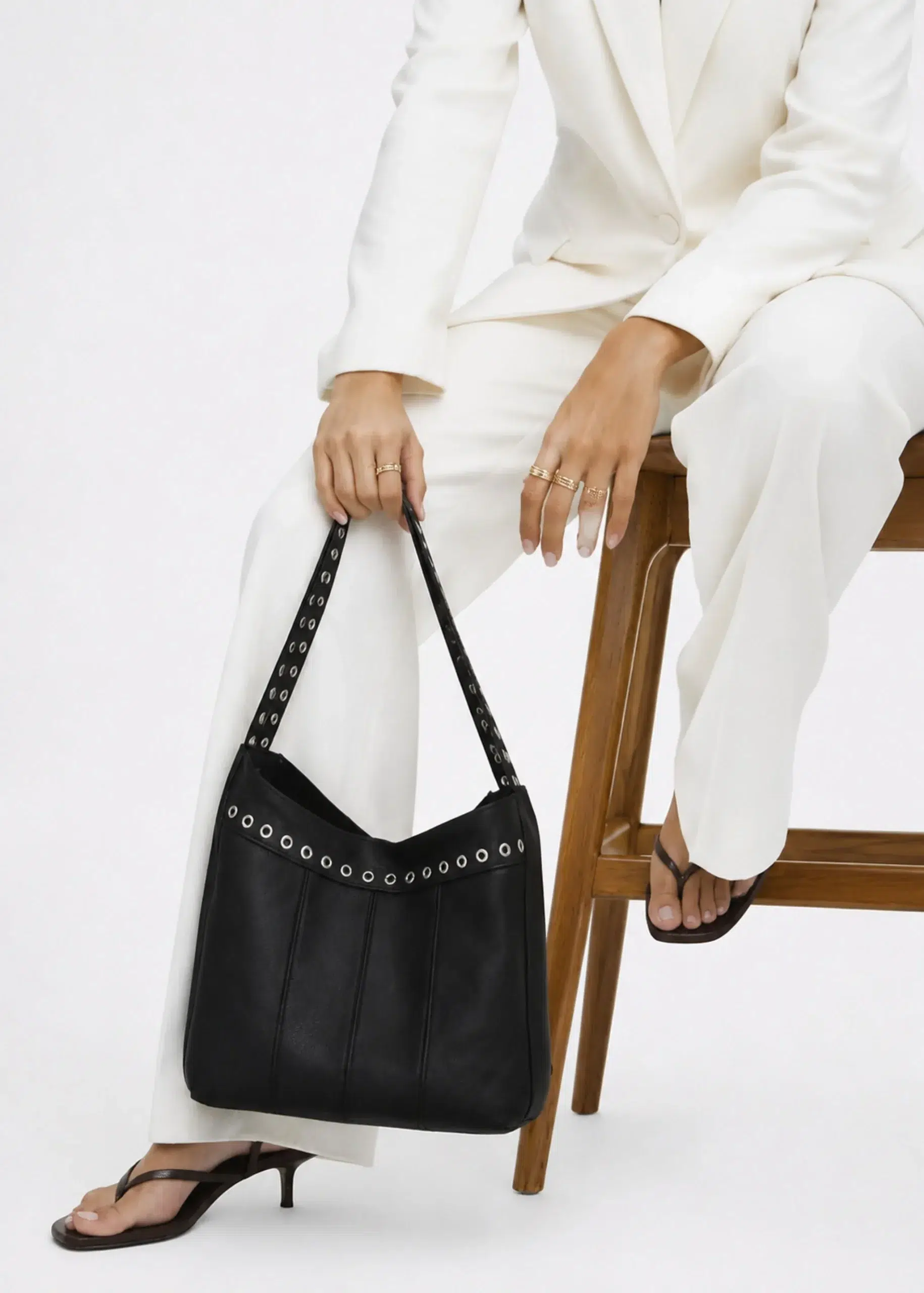 black-studded-leather-shoulder-bag-scaled.webp