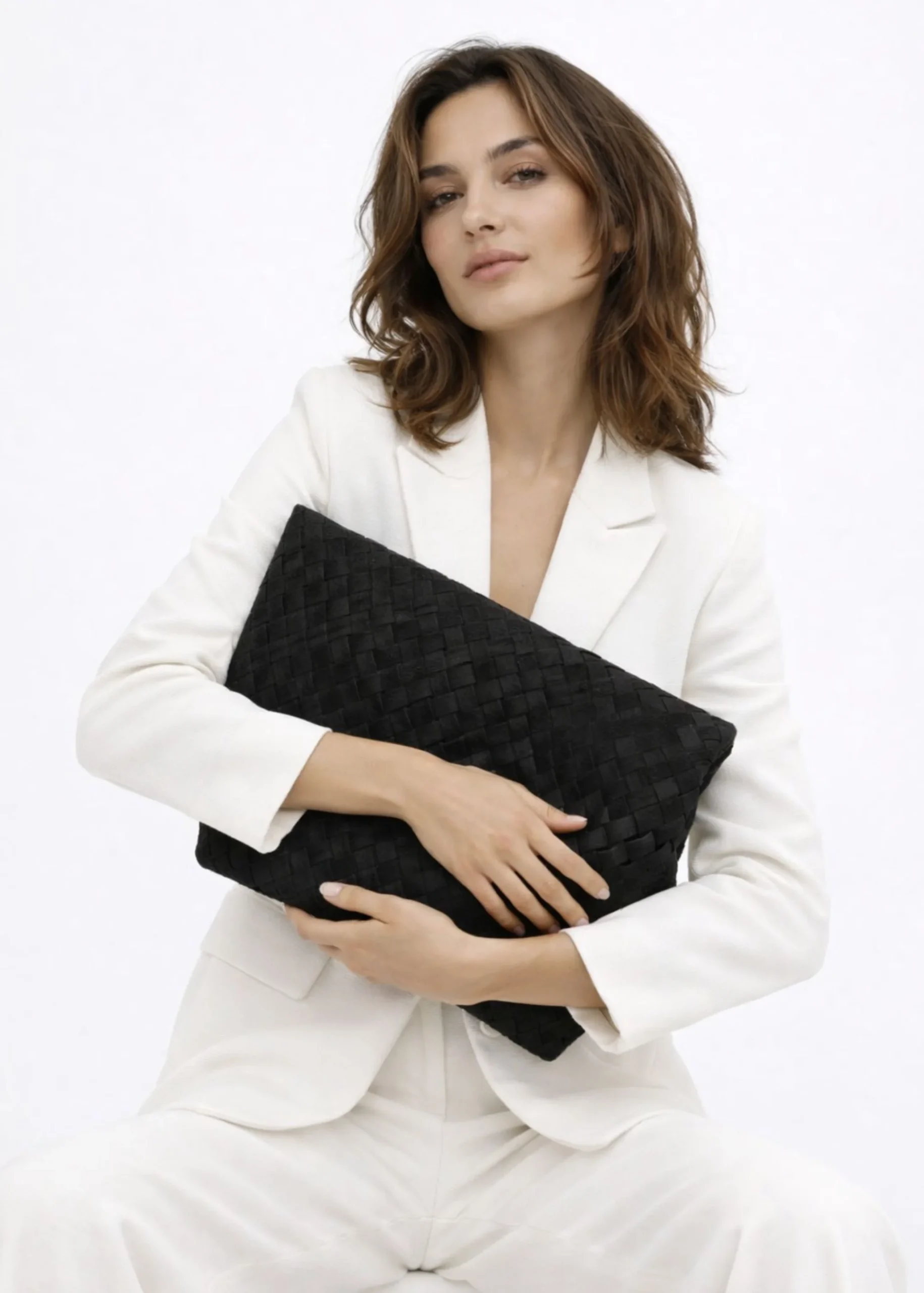 black-suede-woven-clutch-bag.webp
