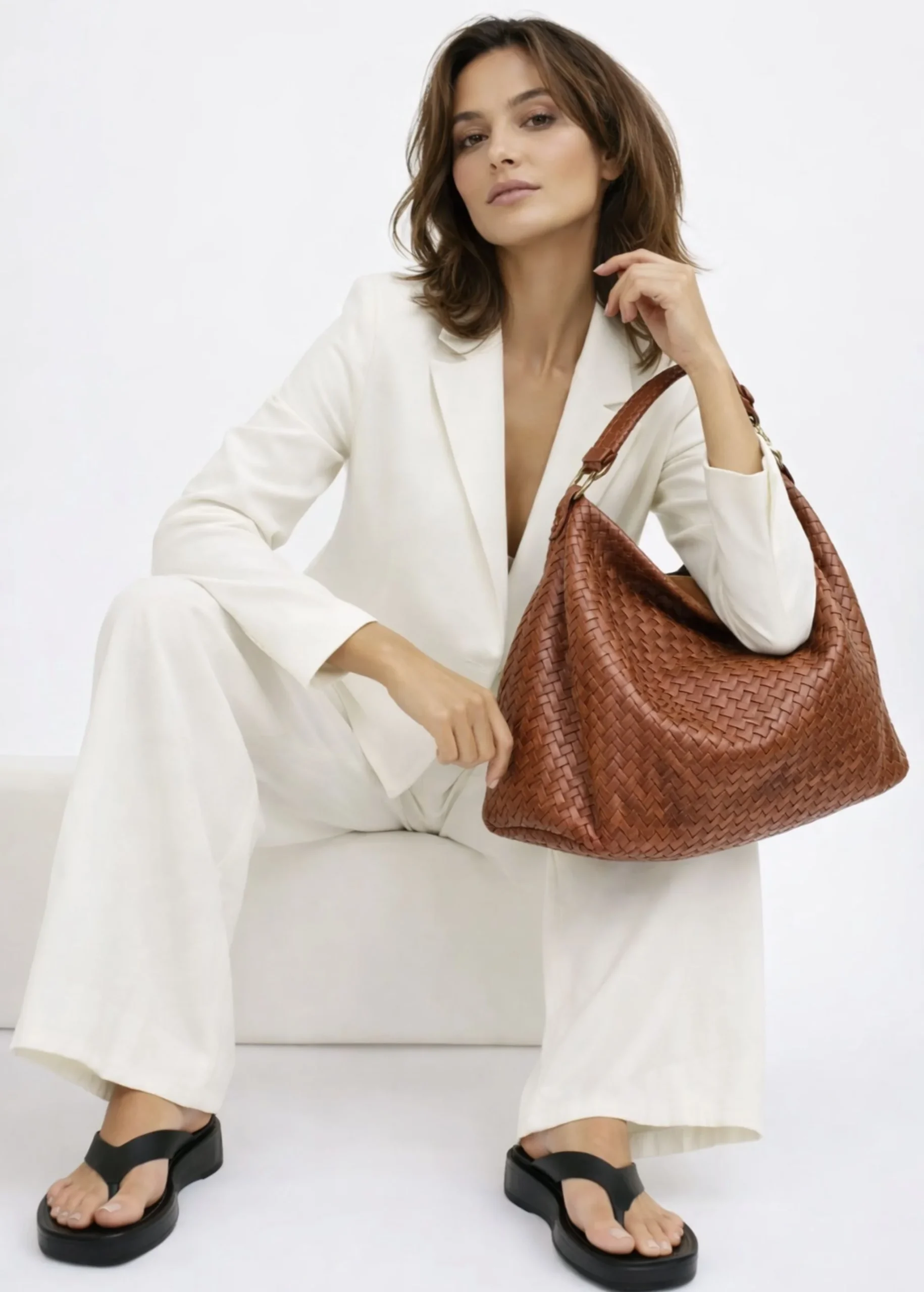womens-brown-woven-leather-bag.webp