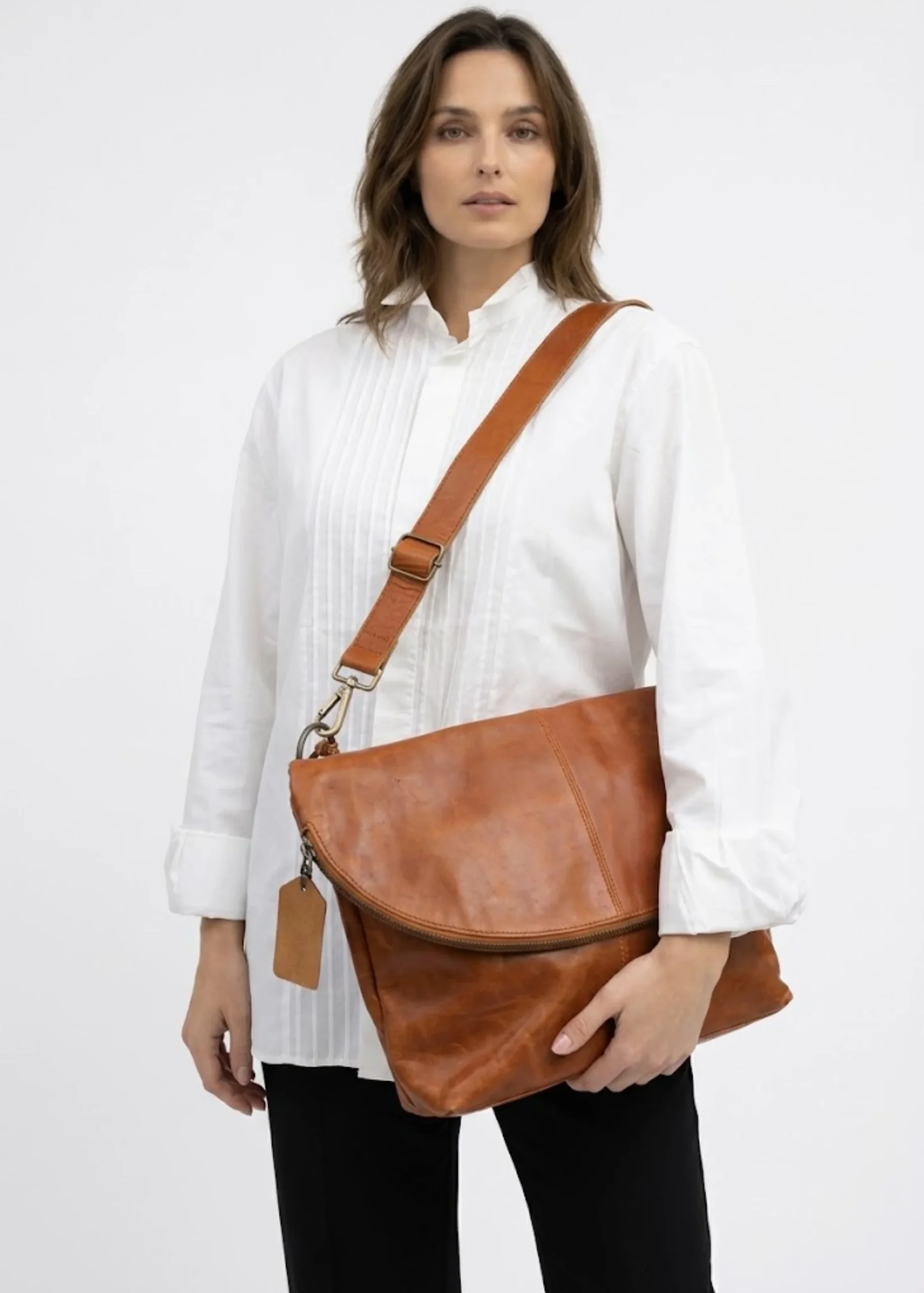 cognac-brown-leather-foldover-crossbody-bag.webp