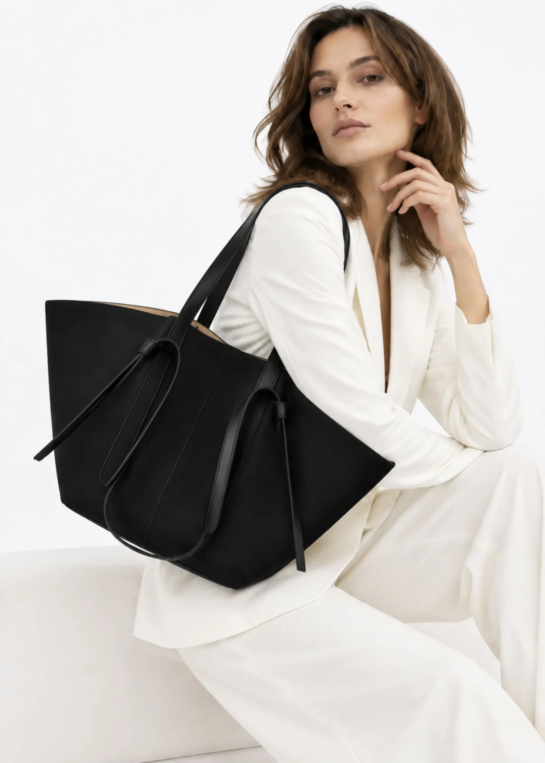 women-black-suede-winged-tote-bag.webp