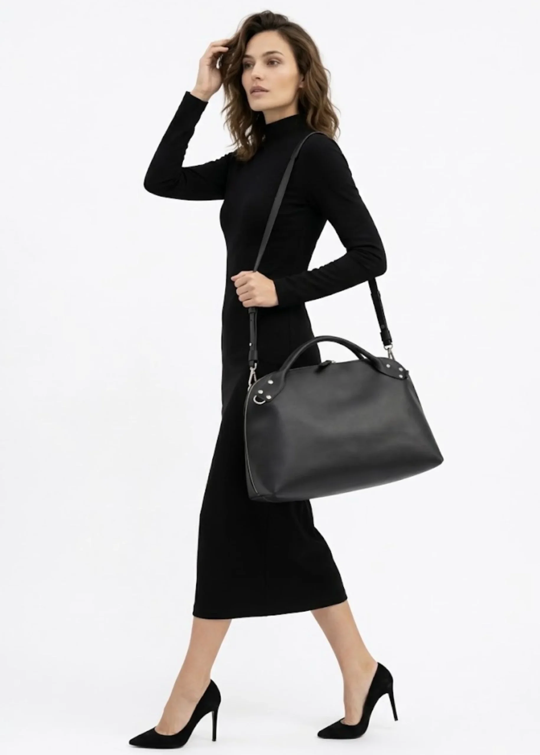 women-leather-black-travel-duffel-bag.webp